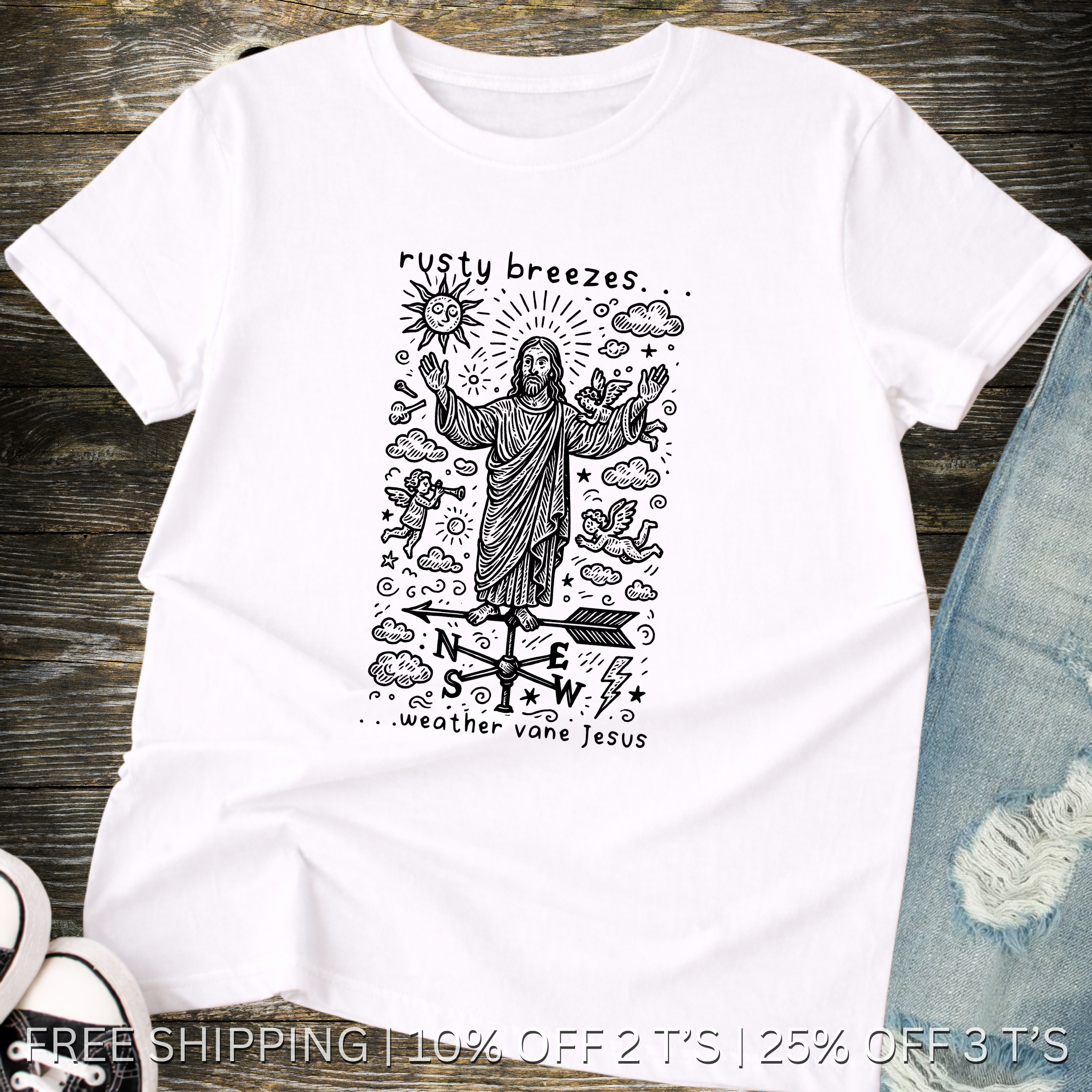 White t-shirt with a graphic design featuring a figure resembling Jesus and text on a wooden surface.