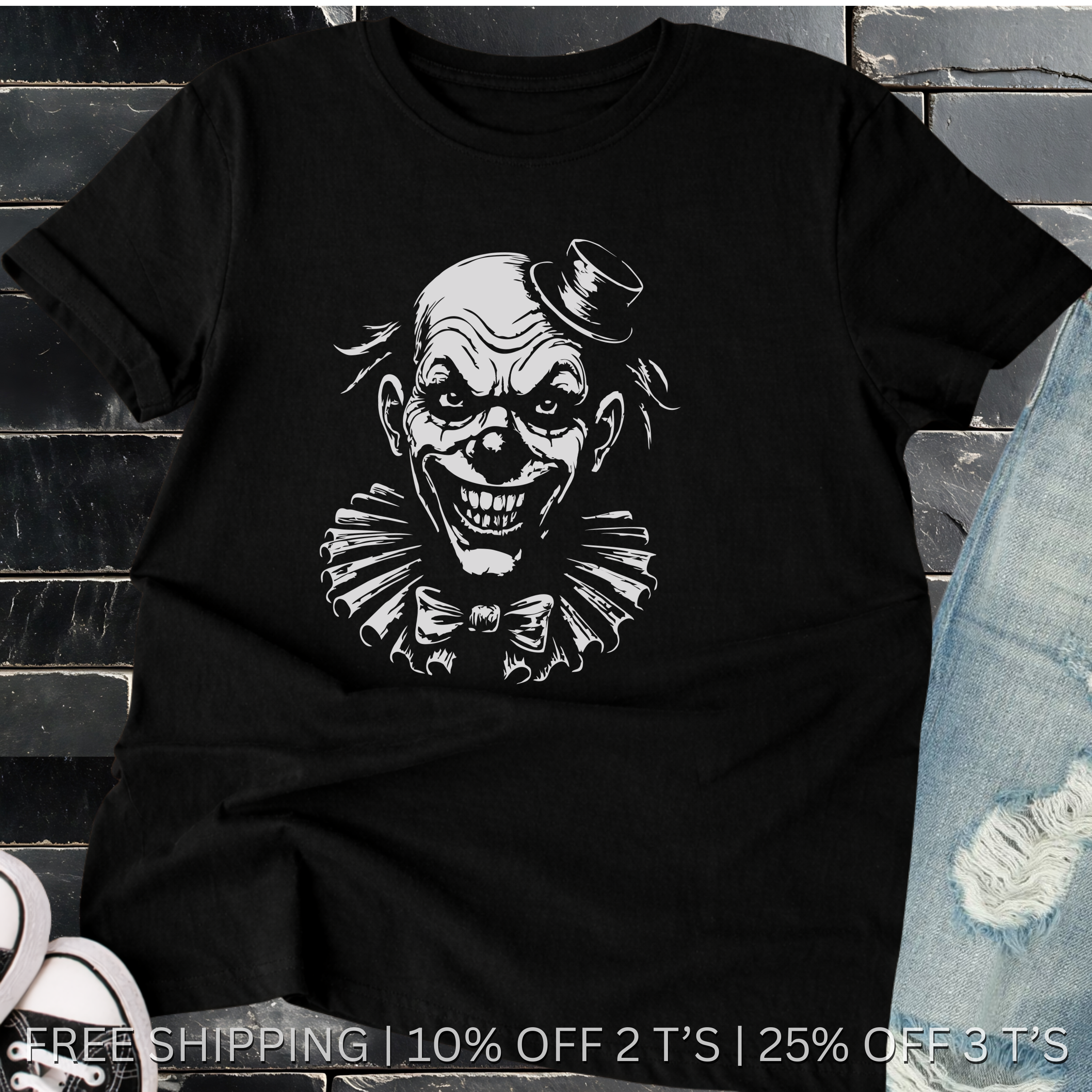 Black t-shirt with a graphic of a clown's face on a stone surface.
