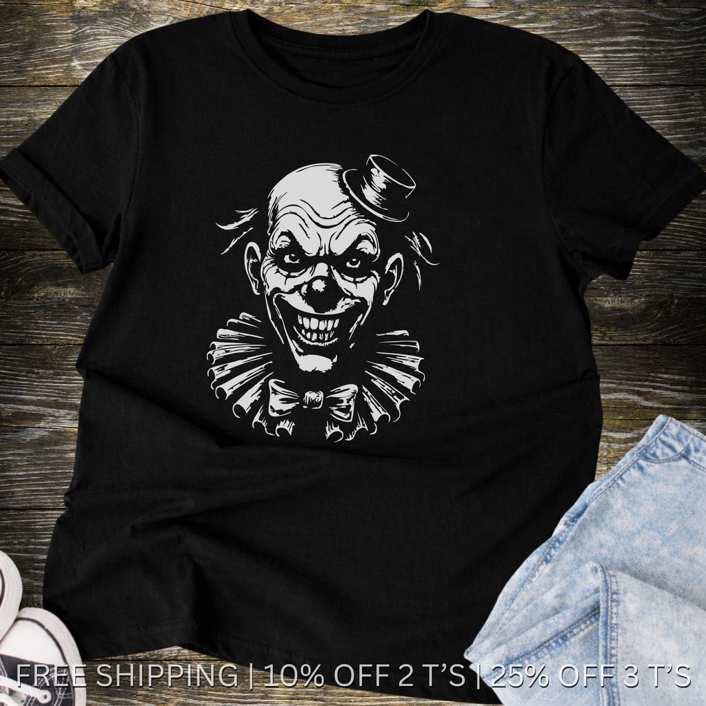 Black t-shirt with a graphic of a clown's face on a wooden surface